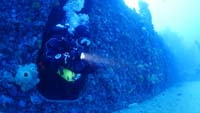 TDI-Diver-Exiting-Wreck-with-Flashlight-Photo-Thumbnail