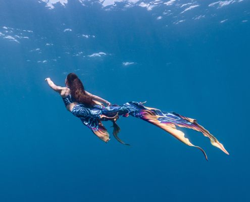 mermaid freediving in open water