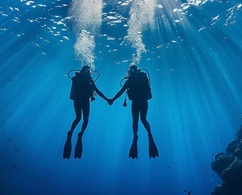 2 Divers Holding Hands