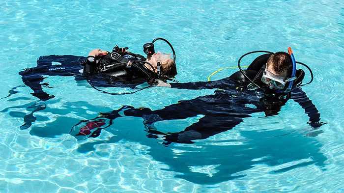Diver performing a tired diver tow
